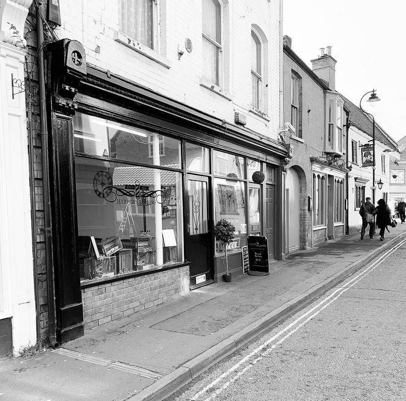 Black and white photo of the shop and Queen Street